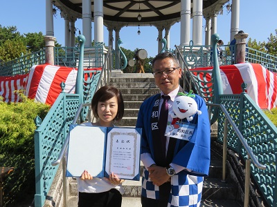 写真：表彰式の様子（峯田さん）