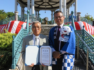 写真：表彰式の様子（田中さん）