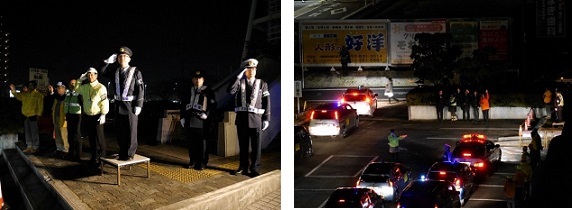 写真：敬礼で青パトを見送る関係者の様子です