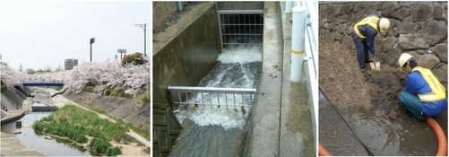 山崎川の桜の風景、水路のスクリーン、土砂を取り除く作業の写真