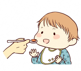離乳食を食べる乳児